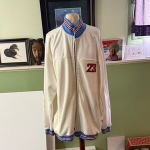 White basketball warm up jacket with Blue and Red Accents, number 23